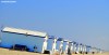A string of beach huts stretch into the distance on Hoek Van Holland Strand in the Netherlands.