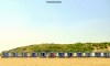A neat line of beach huts on Hoek Van Holland Strand on the Netherlands coast.
