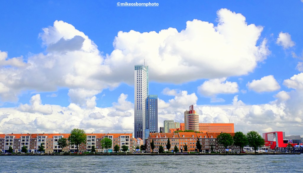 A view of the south bank of the Nieuwe Maas river in Rotterdam, including the Deloitte skyscraper.