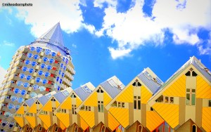A conical tower block and famous yellow of the Cube Houses in Rotterdam, Netherlands.