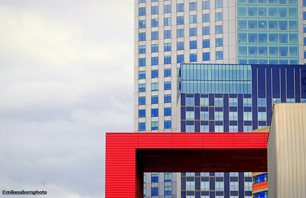 Layers of different coloured modern buildings in Rotterdam, Netherlands.