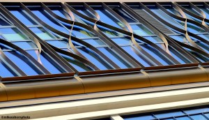An ornate covering adorns the glass on a central Rotterdam building.