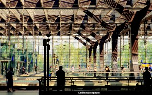 The platforms of Rotterdam Central station shimmer as sunlight is diffused through the building.