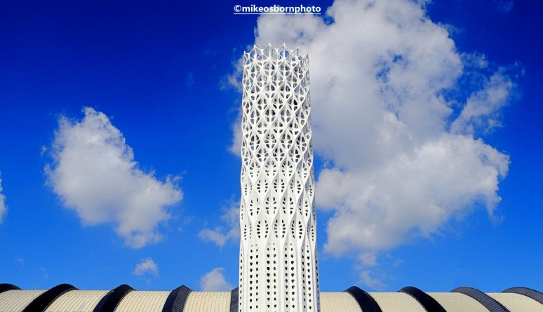 Manchester's ornate Tower of Light rising above the roof of Central Station.