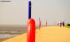 Brightly-coloured coastal safety equipment by Granny's Bay on the Lancashire coast.