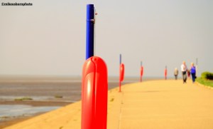 Brightly-coloured coastal safety equipment by Granny's Bay on the Lancashire coast.