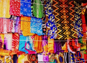 Very colourful fabrics on sale at a market stall in Mutsamudu, Comoros Islands.