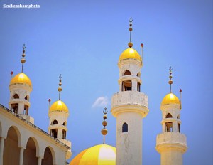 The golden minarets of the mosque and mausoleum in Domoni, Comoros Islands.