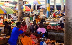 Shoppers gather at a stall selling meat in the main market of Moroni in the Comoros Islands.