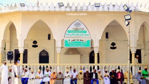 A group of men gather at a mosque close to Moroni harbour in the Comoros Islands.