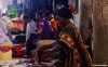 A woman at the market in Moroni, Comoros Islands, prepares a tuna fish.