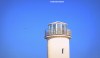 A former lighthouse at Hoylake on the Wirral against a flawless blue sky,