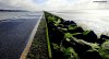 A lowdown view of the pathway circling the Marine Lake at West Kirby on the Wirral Peninsula.