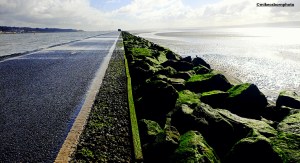 A lowdown view of the pathway circling the Marine Lake at West Kirby on the Wirral Peninsula.