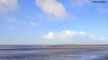 A view across the sands to Hilbre Island in the Dee Estuary at Wirral.