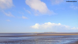 A view across the sands to Hilbre Island in the Dee Estuary at Wirral.