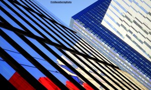 The glass facades of modern buildings near First Street in Manchester.