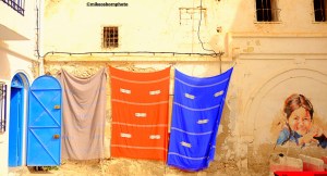 Colourful fabrics on display on a corner of the old market at Houmt Souk, Djerba, Tunisia.