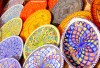 Brightly coloured ceramics on display in the old market of Houmt Souk in Djerba, Tunisia.