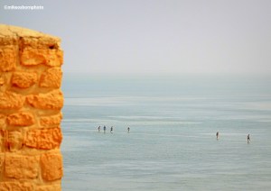 Bathers paddling in the shallows off Tunisia's Djerba island, as seen from Ghazi Mustapha fort.