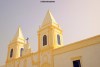The lemon-coloured Catholic church situated in the town on Houmt Souk, Tunisia.