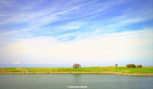 A tranquil view of a small building next to Fleetwood boating lake.