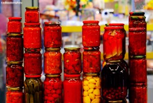 Various colourful jars of pickled goods in Almaty's Green Market, Kazakhstan.