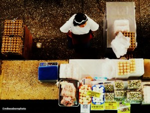 A seller in Almaty's Green Market waits for customers.