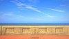 Layers of pavement, sea wall, sea and sky at the South Shore area of coastal town Blackpool.