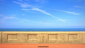Layers of pavement, sea wall, sea and sky at the South Shore area of coastal town Blackpool.