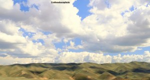 Huge skies above rolling, rugged hills close to the Black Canyon in Kazakhstan.