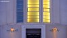 The illuminated entrance to Morecambe's iconic Midland Hotel captured at dawn.
