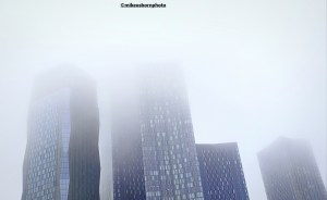 The skyscrapers of New Jackson in Manchester obscured by thick autumn fog.