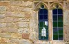 Silhouettes of windows seen in the window of Heysham church on the Lancashire coast.