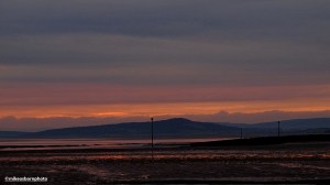 A subtle sunrise over Morecambe Bay with the fells of Cumbria clearly visible.