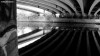 The underside of a bridge over Manchester's River Irwell reflected in the water.