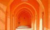 The arches of an ochre covered walkway in the downtown area of El Gouna in Egypt.