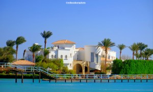 A large palatial white villa overlooking a lagoon in the Egyptian Red Sea resort of El Gouna.