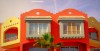 An upmarket red and yellow apartment block on the redeveloped marina area of Hurghada in Egypt.